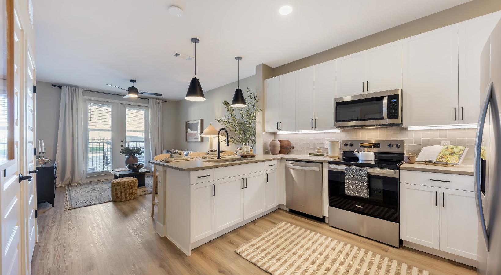 a kitchen with white cabinets