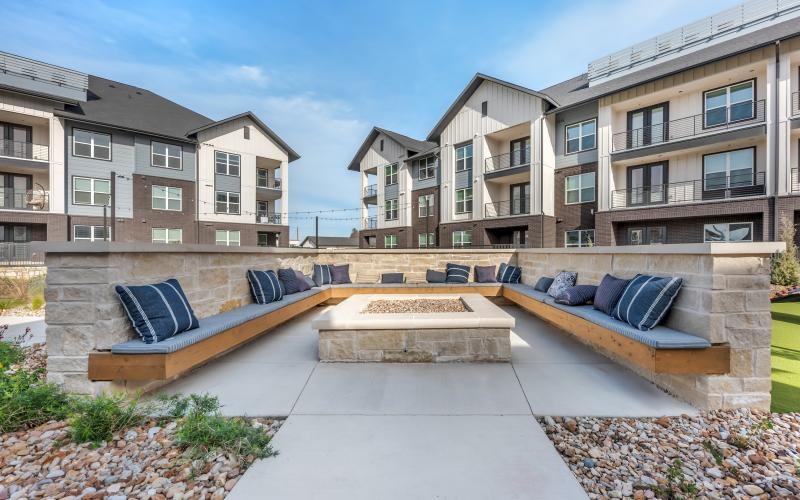 a fire pit with chairs